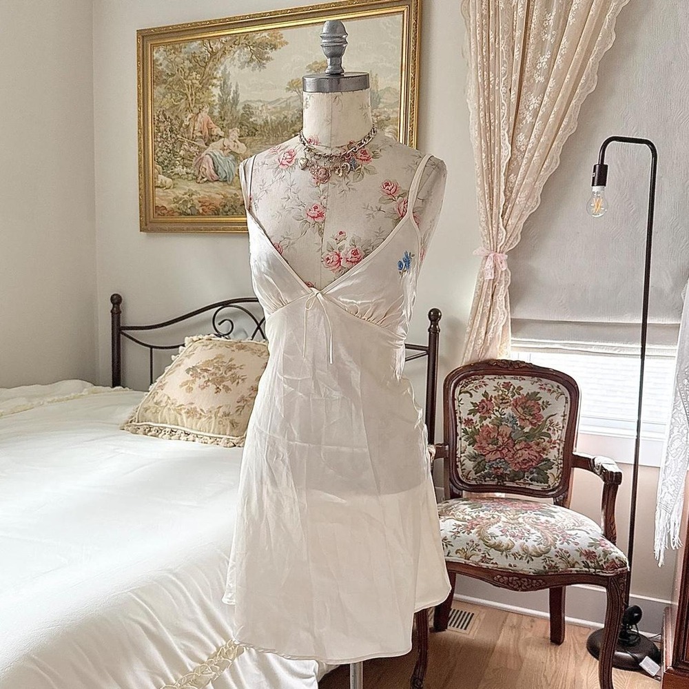 Vassarette fits like a medium ivory satin slip dress